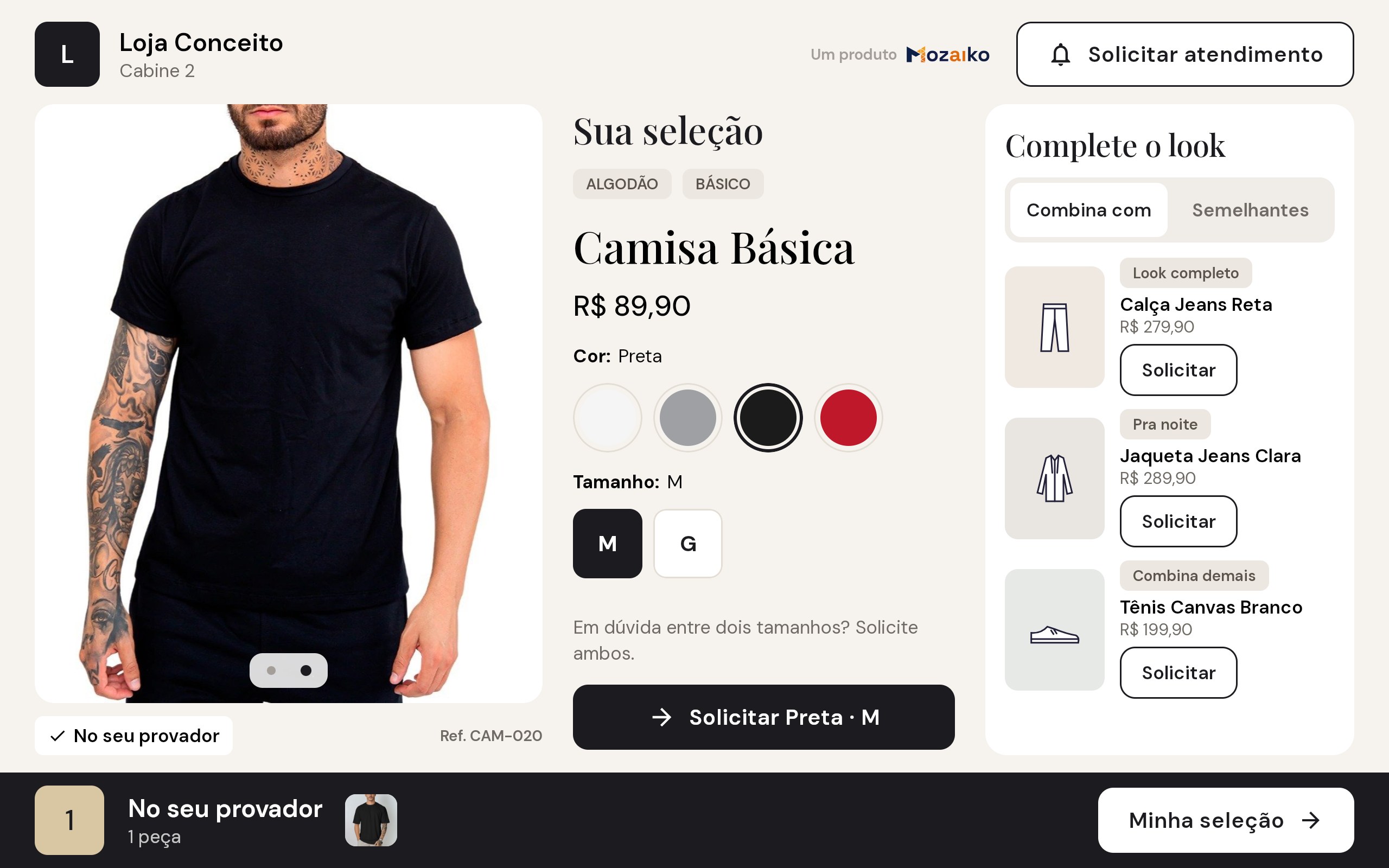 Tela da cabine mostrando a Camisa Básica preta com preço, cores, tamanhos M e G, botão Solicitar e sugestões para completar o look